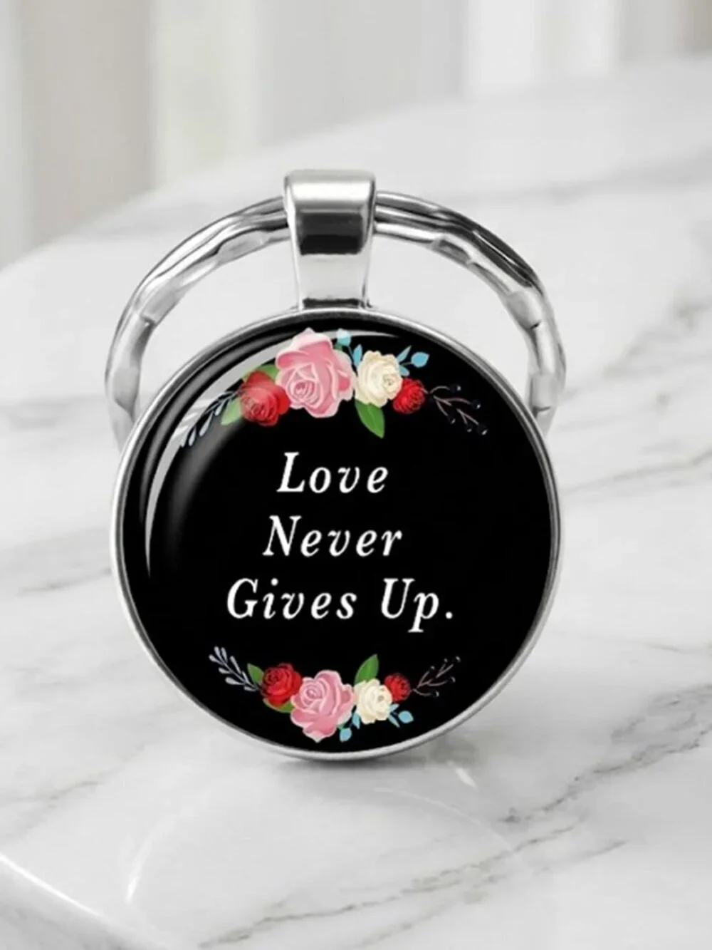 Ladies Black Round Love Never Gives Up Keychain